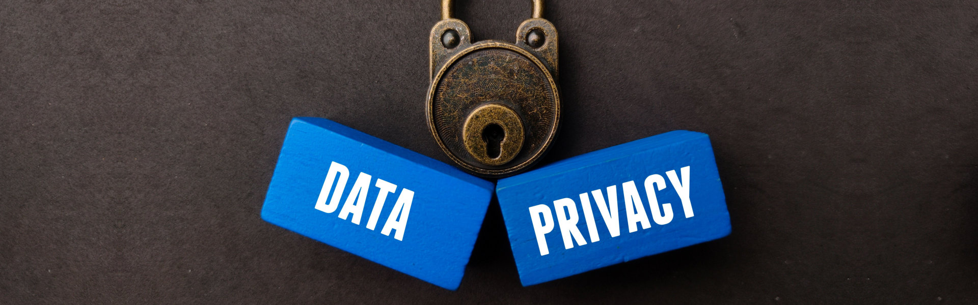Vintage padlock and blue wooden cubes with the words DATA and PRIVACY